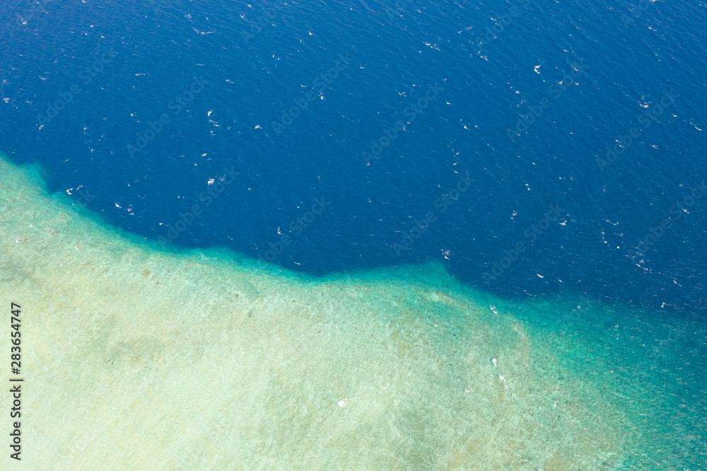 Aerial drone view part of the white island with crystal  clear blue sea water