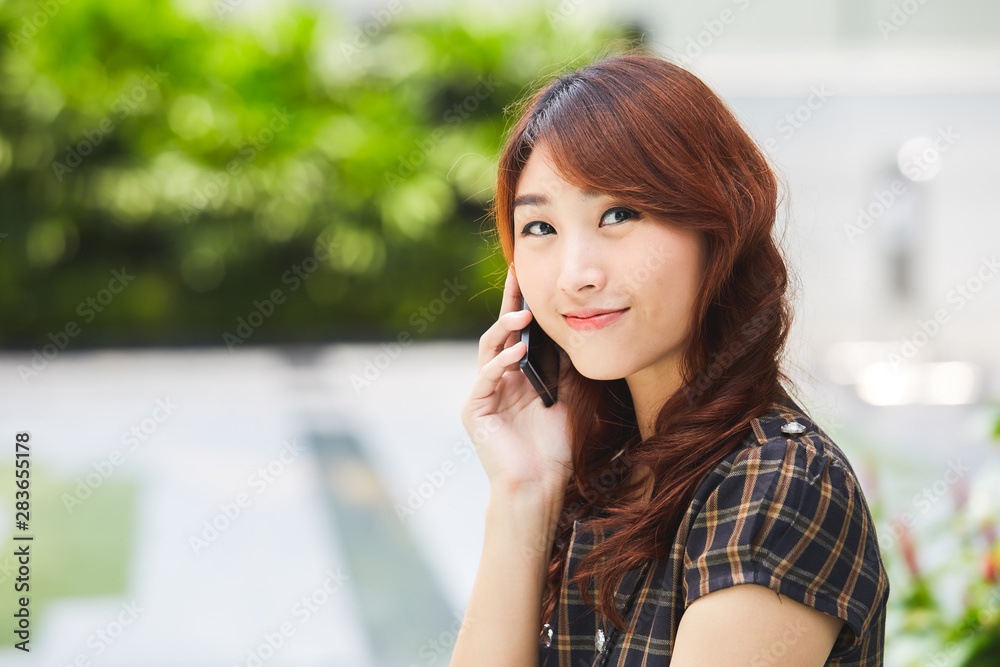 Happy young business woman using mobile phone. Happy young business woman using mobile phone.