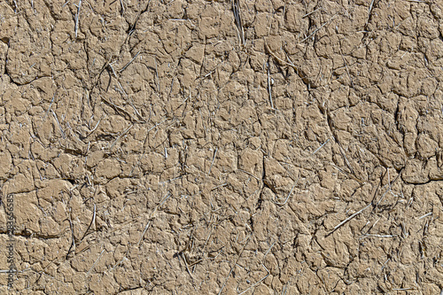 Clay adobe wall outdoors as background