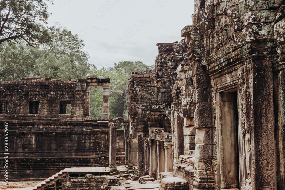 Ruins crumbling of temples in Ankgor Thom, Cambodia surrounded - World Heritage by UNESCO in 1992