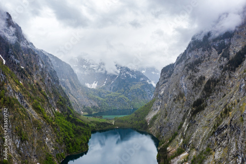 Scenic mountain panorama with green meadows and idyllic turquoise Lake Oberer