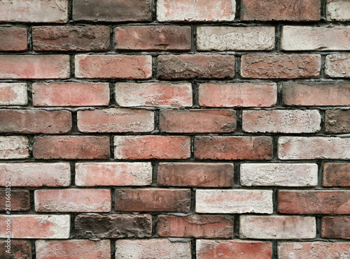 Brick wall background texture and wallpaper. Exterior wall decoration and design.