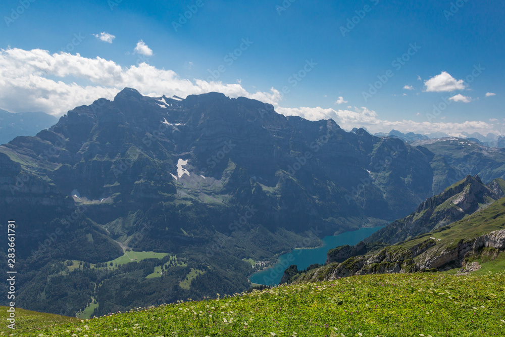 Fototapeta premium Glaernisch mountain, blue sky, lake Kloental in Switzerland