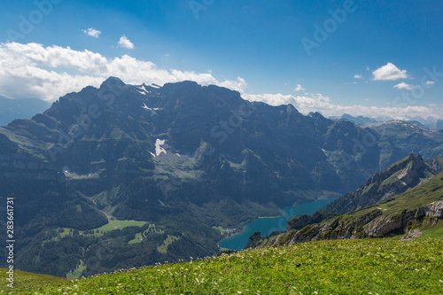 Glaernisch mountain, blue sky, lake Kloental in Switzerland