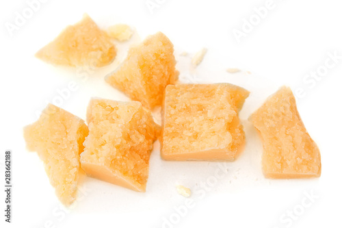 Pieces of parmesan cheese isolated on white background