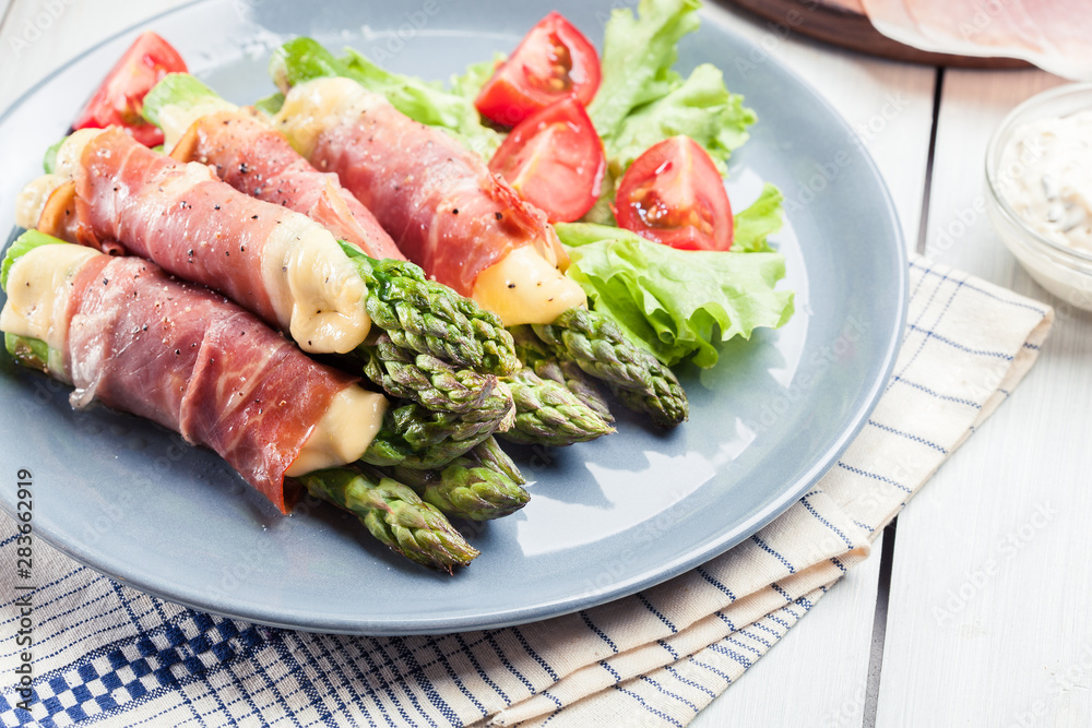 Baked prosciutto and cheese wrapped asparagus