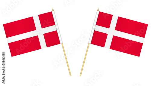Two small Danish flags isolated on white background, vector illustration. Flag of Denmark on pole photo