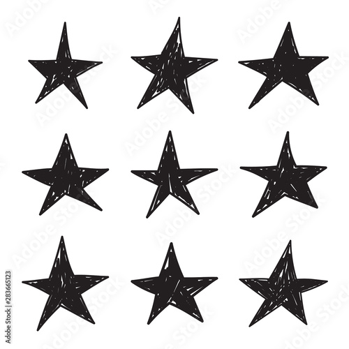 Set of black hand drawn star. Vector collection of unevenly painted stars.