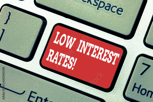 Writing note showing Low Interest Rates. Business photo showcasing meant to stimulate economic growth making it cheaper Keyboard key Intention to create computer message pressing keypad idea