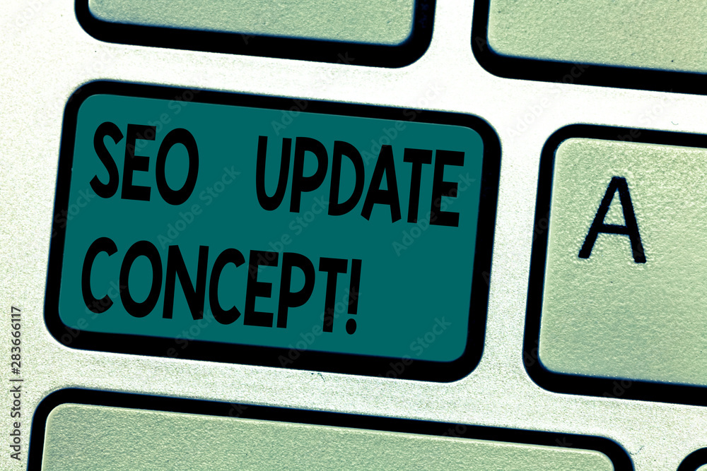Fototapeta premium Text sign showing Seo Update Concept. Conceptual photo improve online visibility of website or page in engines Keyboard key Intention to create computer message pressing keypad idea