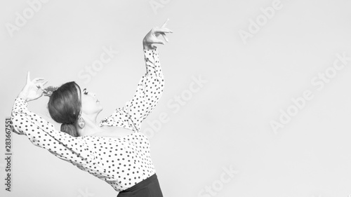 Black and white flamenca dancer bending back with copy space photo