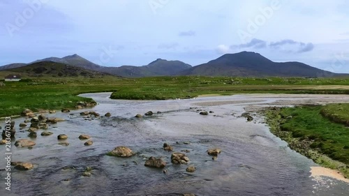 South Uist landscape looking up Howmore river towards the South Uist mountains photo