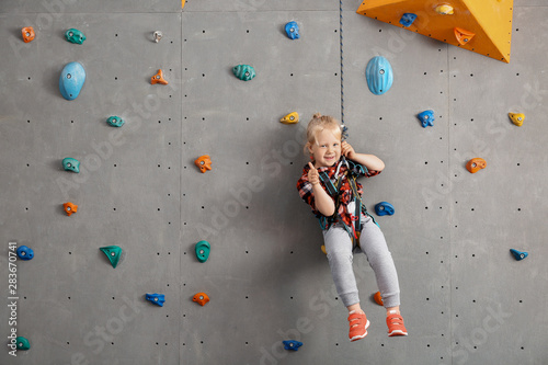 Cute little girl in climbin...