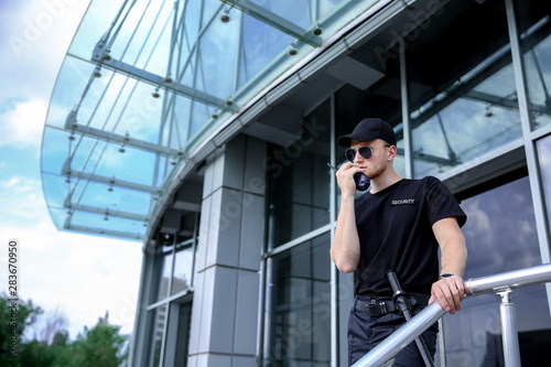 Handsome male security guard outdoors photo