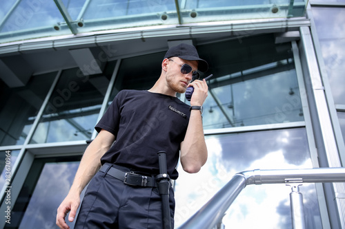 Fototapeta Handsome male security guard outdoors