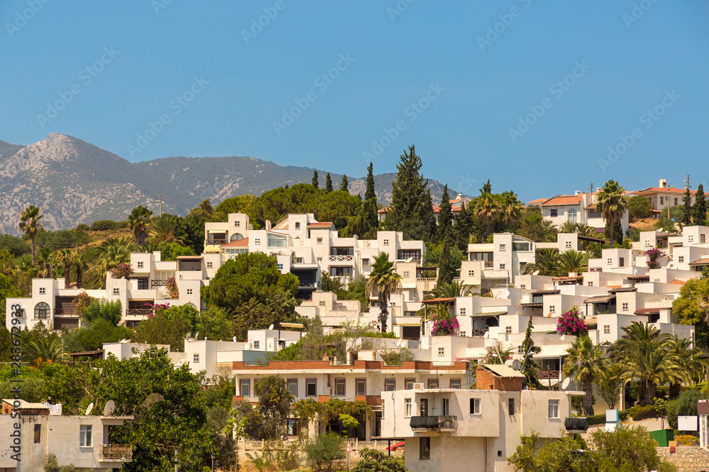 Close Cottages with sea view between pine trees on a hill at Datca Province of Mediterranean Coast of Turkey.