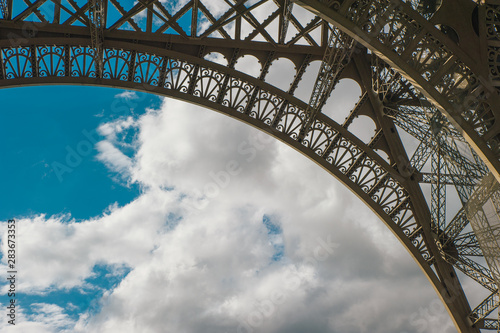 Eiffel tower with blue sky in a cloudy day