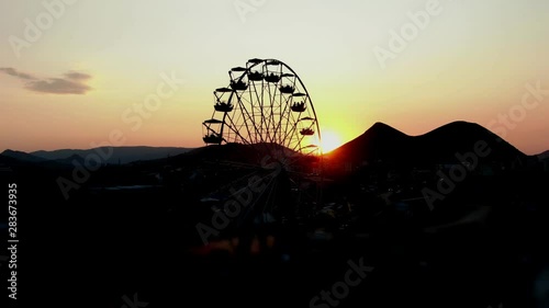 silhouette giant swing on twilight time of the day - can use to montage or portcard CRIMEA MARCH 2019 KOKTEBEL photo