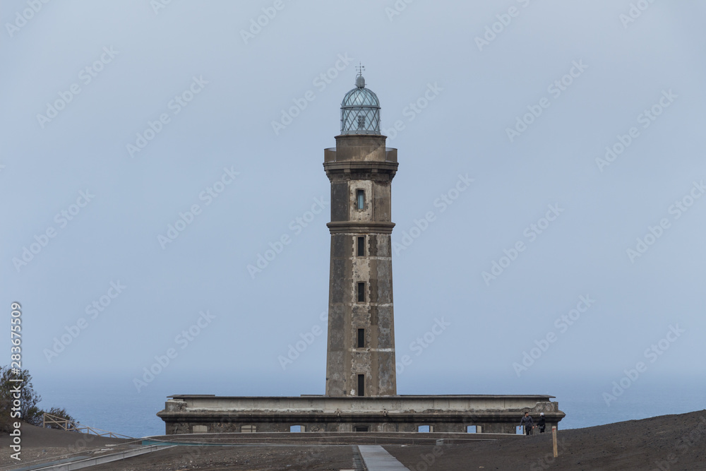 Lighthouse of Ponta dos Capelinhos on western coast on Faial island, Azores, Portugal. Last Capelinhos volcano eruption was in 1957.