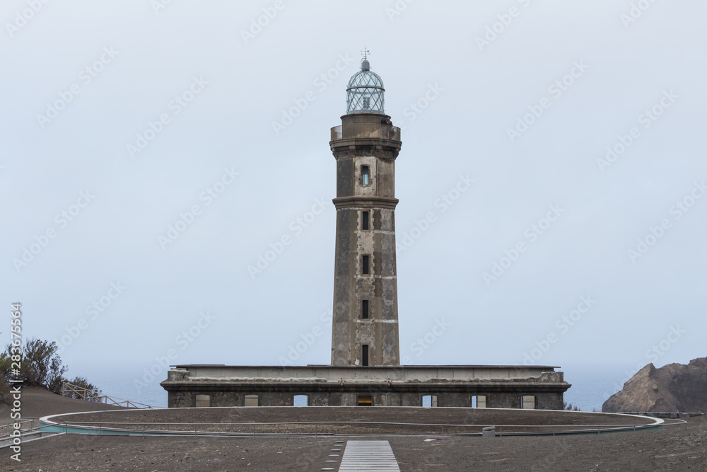 Lighthouse of Ponta dos Capelinhos on western coast on Faial island, Azores, Portugal. Last Capelinhos volcano eruption was in 1957.