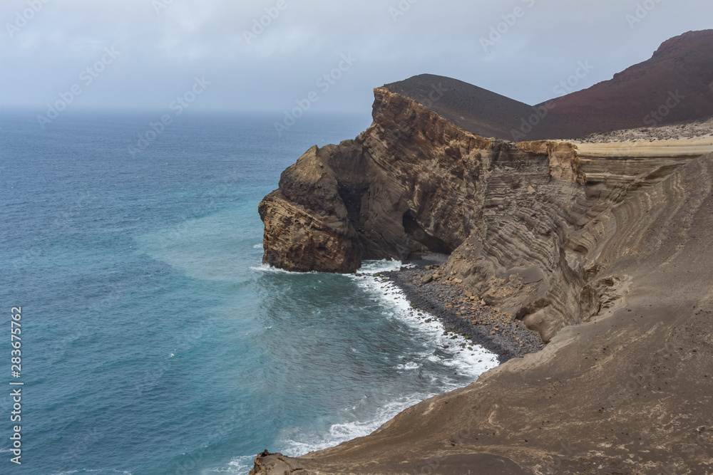 Capelinhos volcano on western coast on Faial island, Azores, Portugal. Last volcano eruption was in 1957.