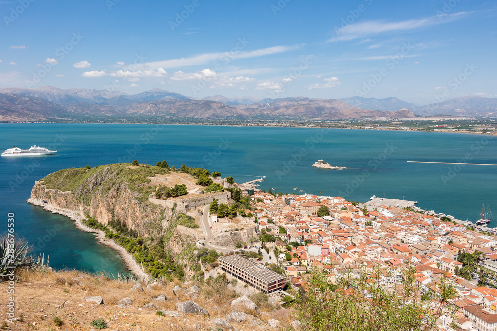 Aerial view from famous Venetian Palamidi fortress and Bourtzi Castle on a small islet in the city of Nafplio former capital of Greece, Peloponnese.