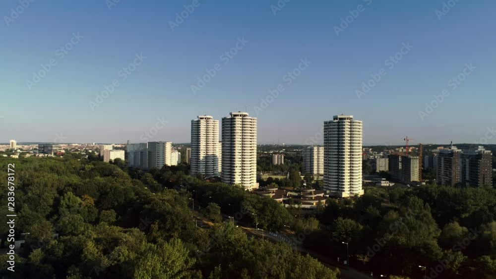 Drone view of city and trees Drone view of city and trees