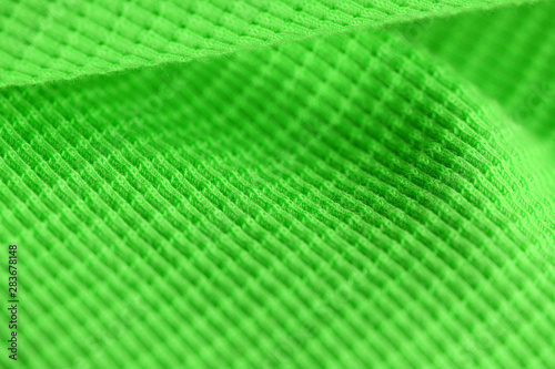 Textile surface of bright green color close-up. Abstract background © Talulla