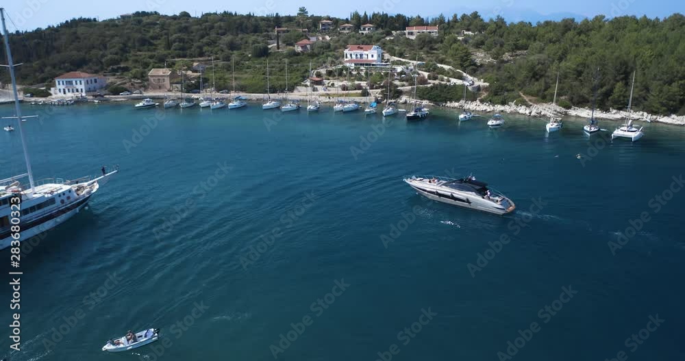 Luxury yachts sailing at Fiskardo Keflonia island port, aerial wide shot Luxury yachts sailing at Fiskardo Keflonia island port, aerial wide shot