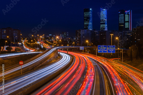 Obraz na płótnie M30 highway at night with Madrid skyline (Four towers business area) as background, Spain w salonie