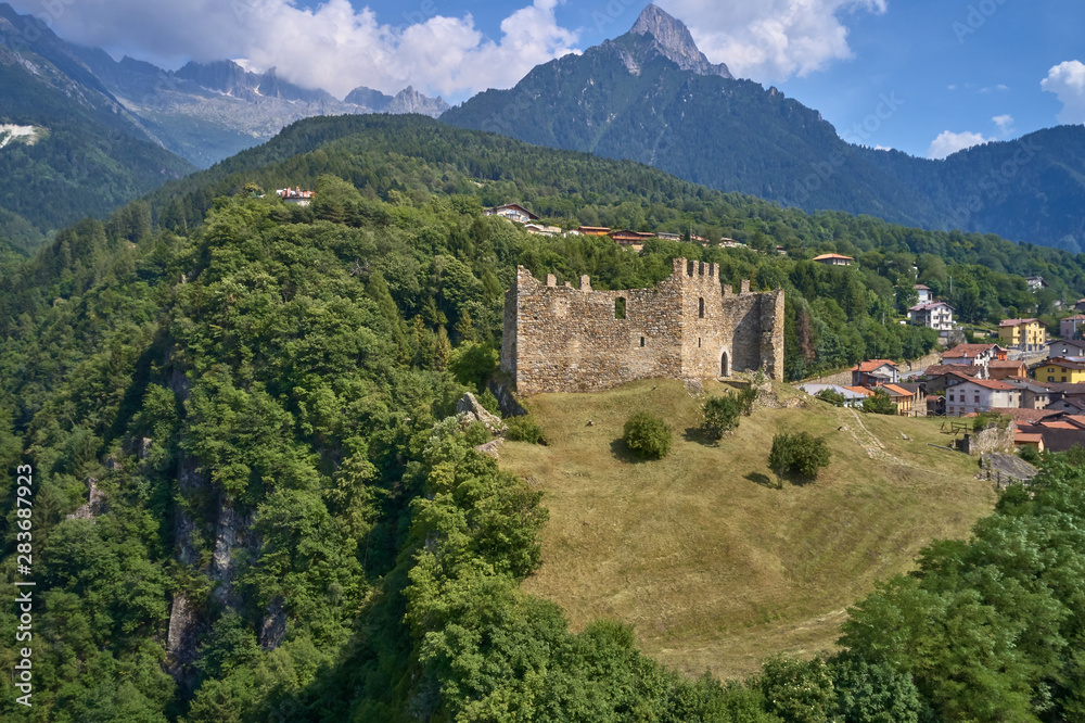 Panoramic view of the Castel Cimbergo region of Trento north of Italy. The ruins of the castle of Cimbergo surrounded by nature, a quiet place on the mountain.