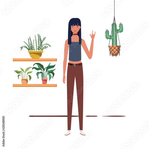 woman with houseplant and macrame hangers