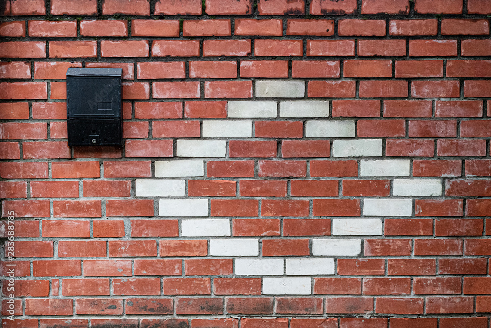 Old red and white brick wall. Mailbox. Space for lettering or design Old red and white brick wall. Mailbox. Space for lettering or design