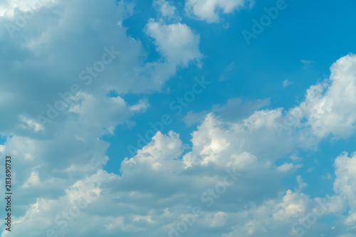Blue sky with clouds on a bright sunny day