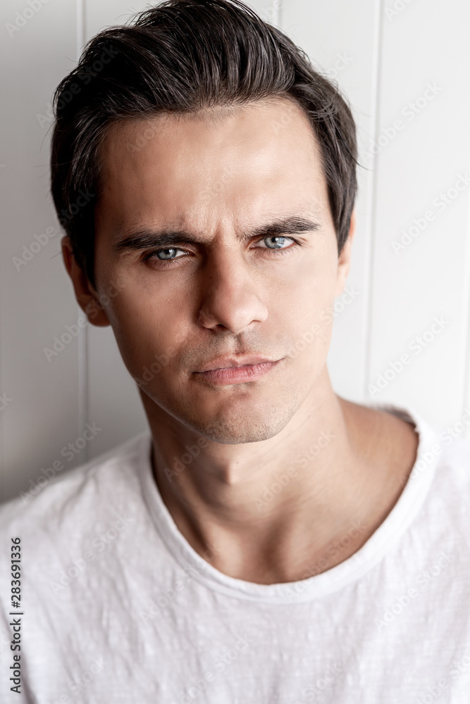 What would that mean? Young guy looking pensive. Human emotions and facial expressions What would that mean? Young guy looking pensive. Human emotions and facial expressions