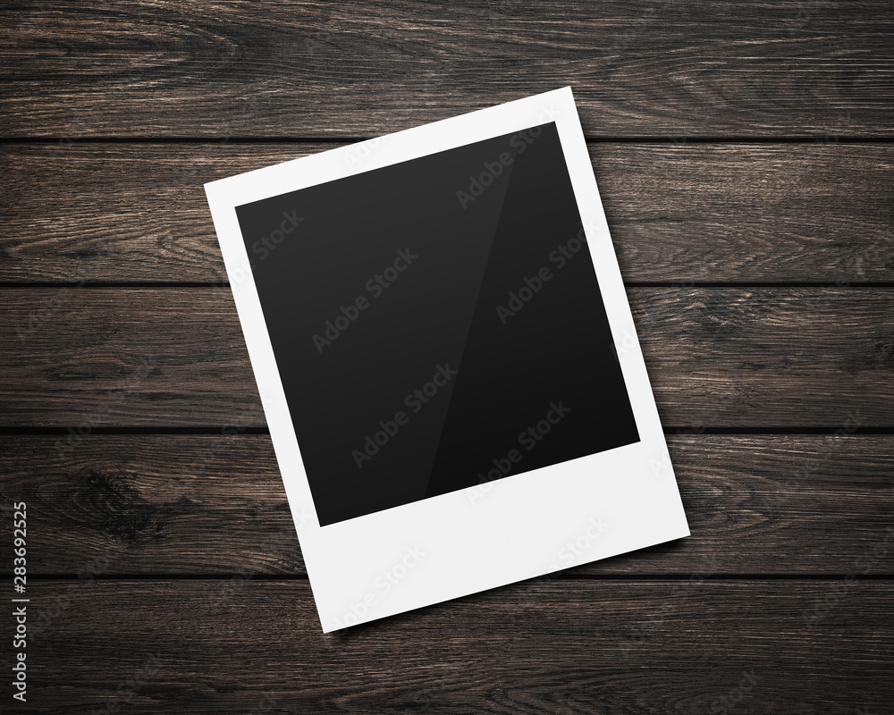 Empty polaroid photo frames mockups template on a wooden table background for putting your pictures. Paper sheet for printing images or recording picture of film cameras. Empty polaroid photo frames mockups template on a wooden table background for putting your pictures. Paper sheet for printing images or recording picture of film cameras.