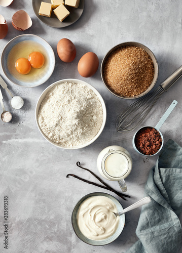 Obraz na płótnie Baking ingredients: flour, eggs, sugar, butter, milk and spices