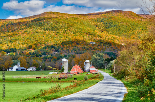 Farm with red barn and silos at sunny autumn day in West Arlington, Vermont, USA photo