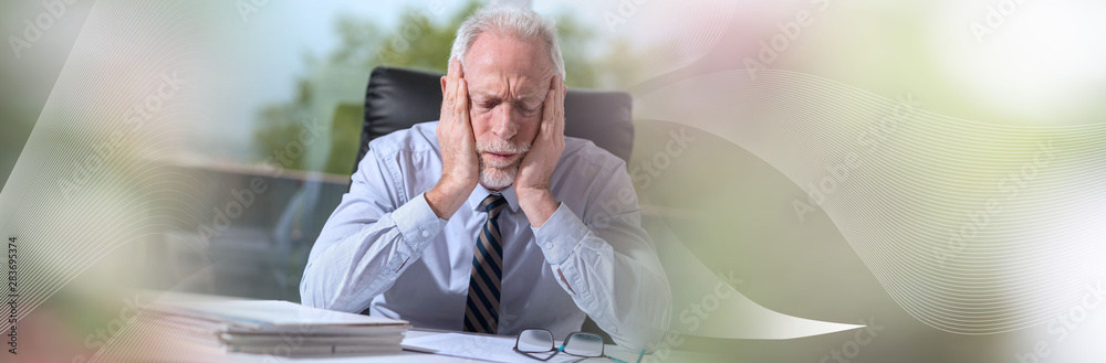 Tired businessman sitting in office; panoramic banner Tired businessman sitting in office; panoramic banner