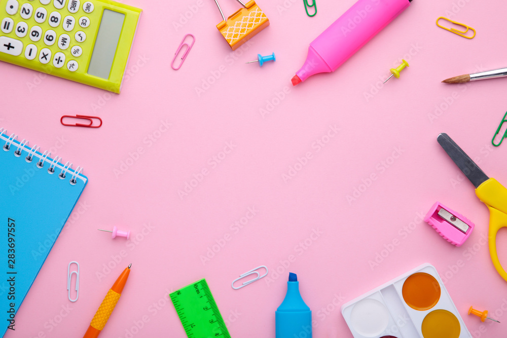 Back to school concept on pink background with copy space