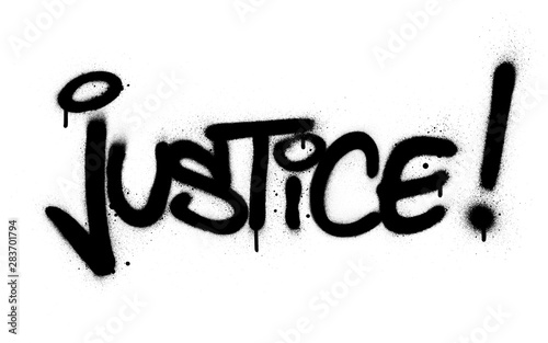 graffiti justice word sprayed in black over white