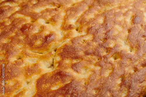 Italian focaccia bread on a baking tray