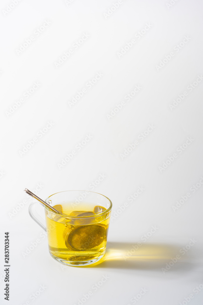 A cup of Chamomile tea in a clear glass mug
