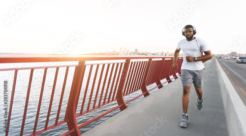 Enthusiastic afro jogger getting ready for marathon