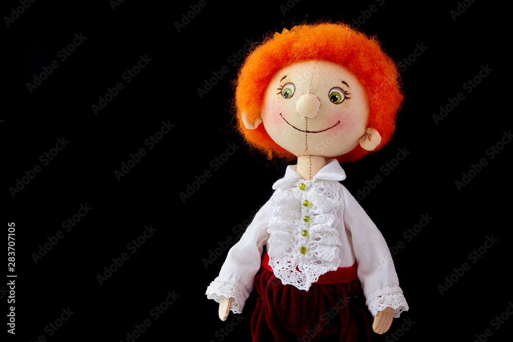 Soft stuffed handmade doll (toy) of young boy with red hair and white shirt Soft stuffed handmade doll (toy) of young boy with red hair and white shirt
