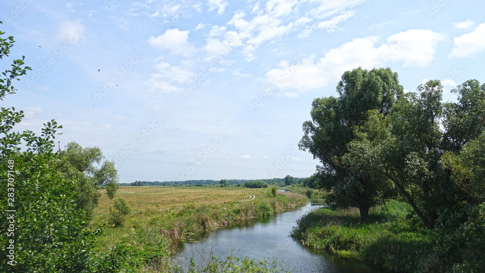 Small river in the countryside, summer day Small river in the countryside, summer day