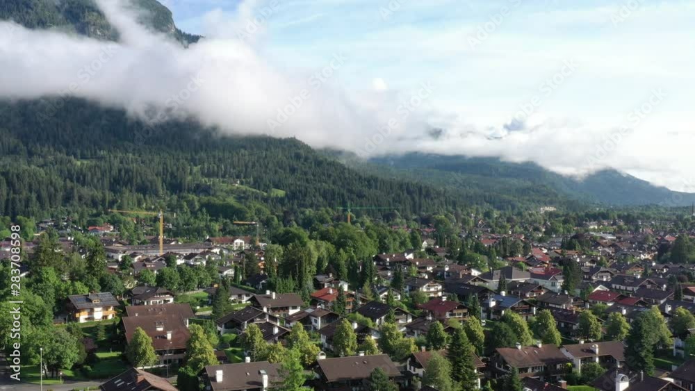 Aerial view of houses with holiday flats on the edge of a town for tourism in the German Alps Aerial view of houses with holiday flats on the edge of a town for tourism in the German Alps