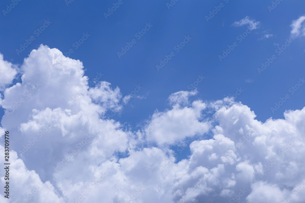 Blue sky and white clouds, rain clouds on sunny summer or spring day.