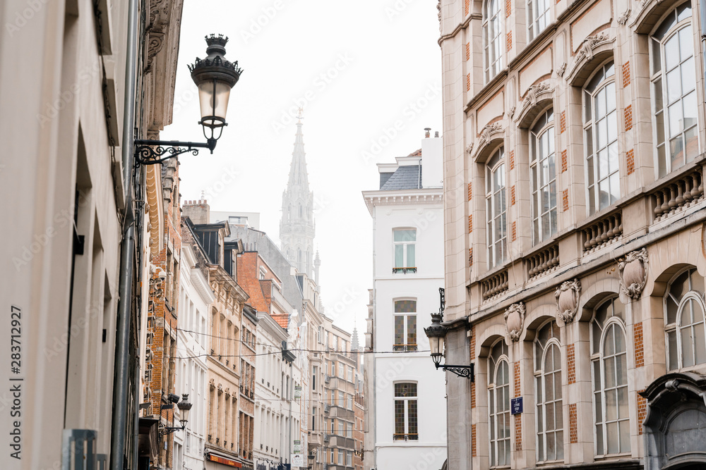 Editorial. Bruxelles, Belgium - May 2019: view of the beautiful old brussels street in rainy foggy weather