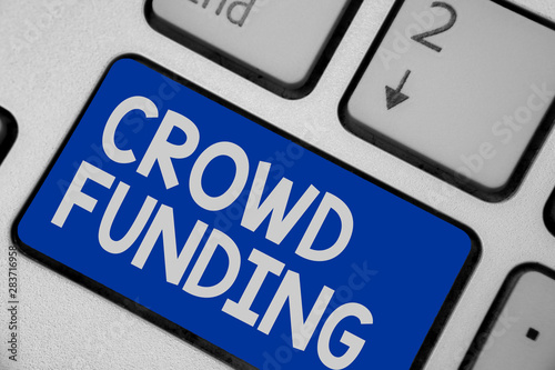 Writing note showing Crowd Funding. Business photo showcasing Fundraising Kickstarter Startup Pledge Platform Donations Keyboard blue key Intention computer computing reflection document photo